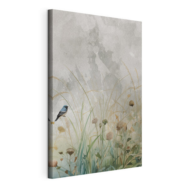 Bird on a branch in a field of grass